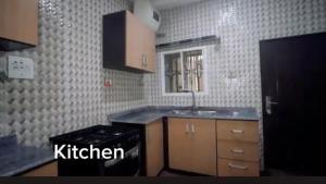 a kitchen with a sink and a counter top at Living Space Home in Lekki