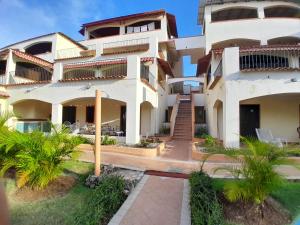 a view of the front of a building at Palm Beach Resort in Boca Chica