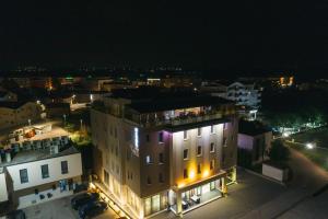 a night view of a building in a city at Hotel Villa Pace in Međugorje