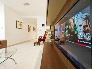 a hallway with a large screen in a building at Good Times in Sliema