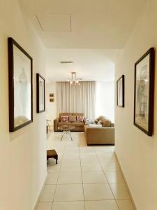 a living room with a couch and a table at Good Times in Sliema