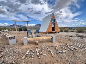 a tiny house in the middle of the desert at Star Gazer #3 Glamping in Meadview