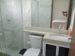 a bathroom with a shower and a toilet and a sink at Casa do Descanso in Triunfo +19 photos