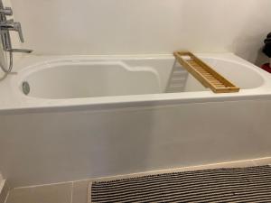 a white bath tub with a thermometer on top of it at Lulus Kastri in Keratokampos +72 photos
