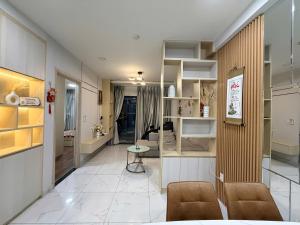 a living room with a couch and a table at Youyi House in Dĩ An