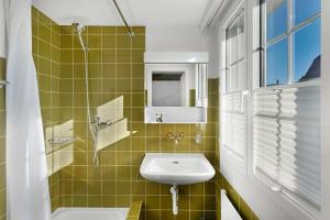 a bathroom with a sink and a mirror at Hotel Schiff in Horn +54 photos