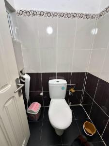 a small bathroom with a white toilet in it at appartement luxe in Berkane +49 photos