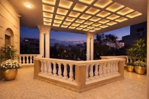 a balcony with a white railing and a view of the city at Cairo Stays Hotel in Cairo
