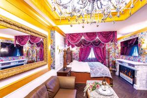 a bedroom with a bed and a chandelier at Hotel Shiro No Kyuden in Ibaraki +37 photos