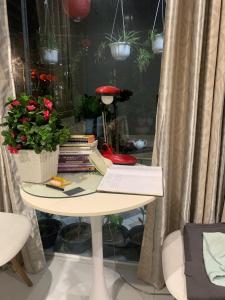 a table with a book and a stack of books at Kavy Homestay in Thôn Trường Giang