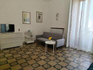a living room with a couch and a table at IN CENTRO apartments in Torre Maggiore