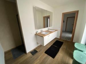 a bathroom with a sink and a mirror at Spacious house specially for workers and expats in Maldegem +21 photos