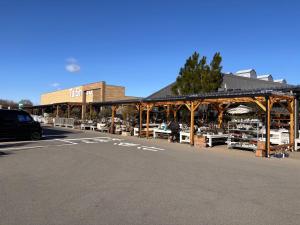 a store with a market with a wooden structure at Oharama House in Nasushiobara