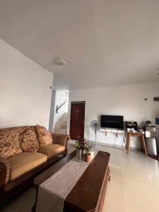 a living room with a couch and a coffee table at HAPDESKO HOMESTAY in Batam Center