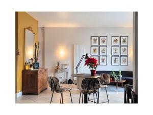 a living room with a table and chairs at Gabriel Hotel Chinon in Chinon