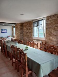 a dining room with a long table and chairs at Amari in Getaria