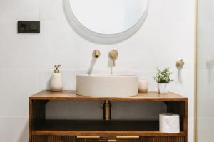 a bathroom with a sink and a mirror at Apartamento Maya Merida in Mérida +6 photos
