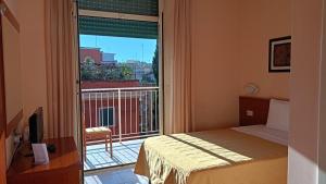 a bedroom with a balcony with a bed and a window at Casa Per Ferie Canobi 18 in Rome