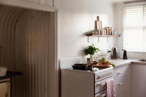 a kitchen with a stove and a counter top at Croftby Hills - Scenic Rim in Croftby