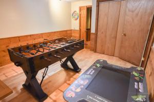 a large foosball table in a room at Private Pool Large Deck and Game Room in Dennis