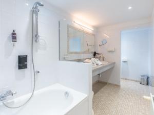 a bathroom with a shower and a tub and a sink at Gîte du Vieux Moulin in Rochefort +21 photos