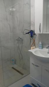 a bathroom with a shower and a sink at Apartman Nera in Gradačac +10 photos