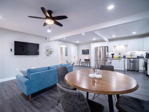 a living room with a blue couch and a table at The Franklin in Marietta in Marietta