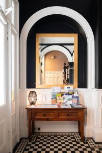 a room with a table and a mirror in a room at Witchwood House in Oban +100 photos