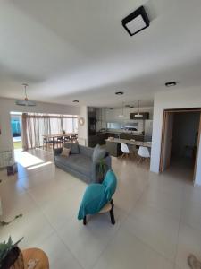 a living room with a couch and a table at Bed and breakfast Maipu in Maipú