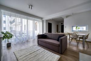 a living room with a couch and a table at Villa Oliver 2 Budapest in Budapest