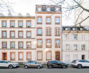 a large building with cars parked in front of it at Strasbourg Evasion Pop in Strasbourg
