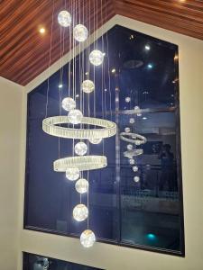 a chandelier hanging from a ceiling in a room at Heaven staycation in Angeles