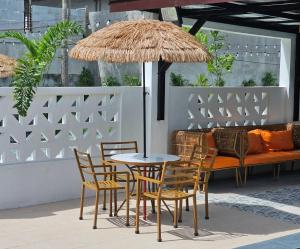 a patio with a table and chairs and a bench at Heaven staycation in Angeles
