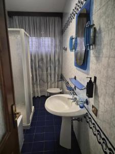 a bathroom with a sink and a toilet at Villa Cantalupo 1 in Sillavengo +34 photos