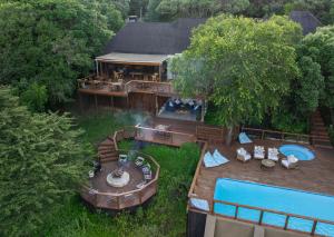 an aerial view of a house with a swimming pool at Malkoha Lake St Lucia in Hluhluwe