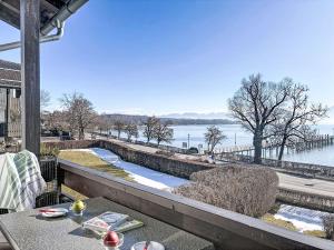 a balcony with a view of a body of water at Apartment Alpenseeblick by Interhome in Seebruck