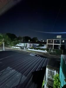 a view of a parking lot at night at apartamentos Don Oscar in Federación