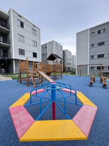 a playground with a play equipment in a park at apartamento ana julia modesto in Juazeiro do Norte