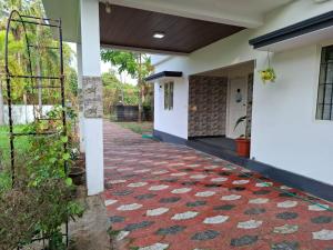 a house with a red carpet on the sidewalk at The Beach House in Cochin +22 photos