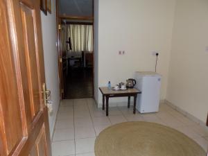 Kuchyň nebo kuchyňský kout v ubytování Kenya Comfort Suites