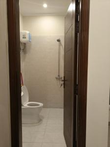a bathroom with a toilet and a shower at Stay Premium in Islamabad +7 photos