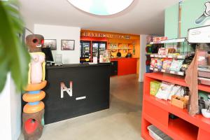 a store with a counter with at Hotel Not Hotel Rotterdam in Rotterdam