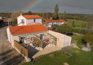 an aerial view of a house with an open garage at chambres d'hôtes "DINEDORT" in LʼAiguillon-sur-Vie