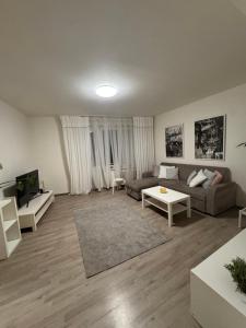 a living room with a couch and a table at Ubytování v centru Ostravy in Moravská Ostrava