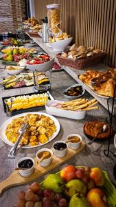 a buffet with many plates of food on a table at Bella Casa Hotel in Monrovia