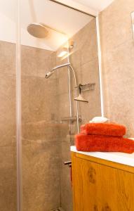 a shower with a glass door in a bathroom at Guesthouse De Vliere in Beerse +15 photos