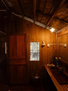 a kitchen with a sink and a window at Le Mékong Vert Ecolodge in Ben Tre