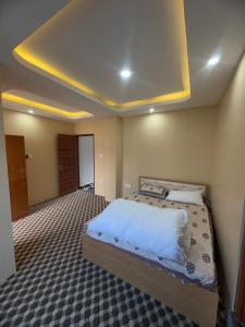 a bedroom with a large bed in a room at Shrestha Hotel And Lodge in Dhāding +2 photos