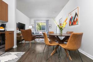 a kitchen and dining room with a table and chairs at The Pendleton Boutique Stylish 1 bedroom Condo in Traverse City