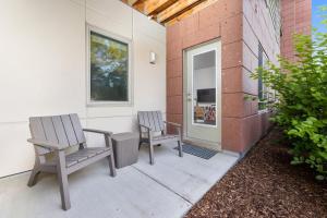 two chairs and a table on a patio at The Pendleton Boutique Stylish 1 bedroom Condo in Traverse City